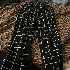 Black pants with white stripes